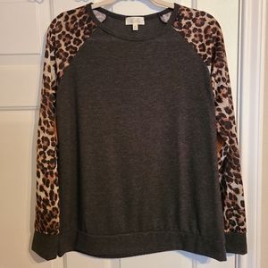 NWOT DARK GREY SWEATER WITH CHEETAH PRINT SLEEVE AND FAUX SUEDE ELBOW PATCHES.